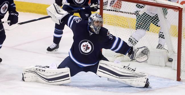 Jets goalie Pavelec likely done for season after arthrscopic knee surgery | iNFOnews.ca CP376563815