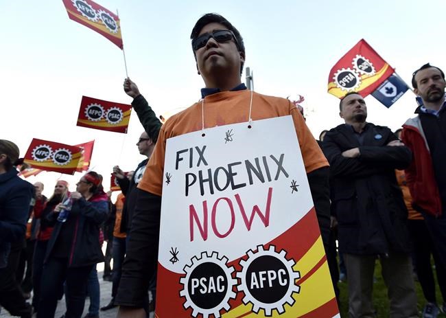 Workers giving up promotions, parental leave because of Phoenix troubles; union | iNFOnews.ca CP313608976