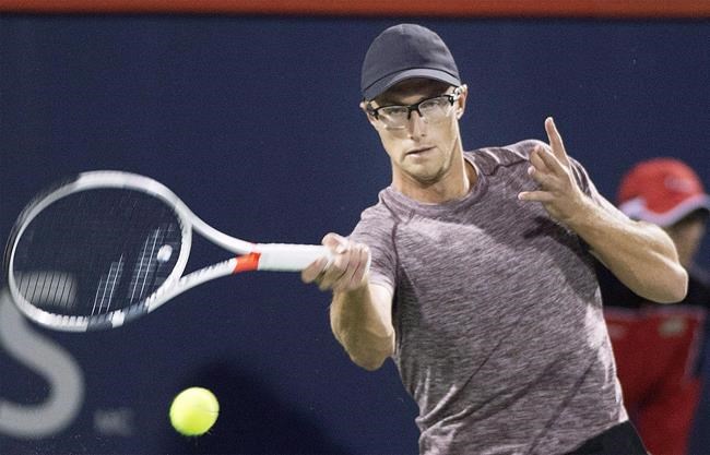 Polansky wins first-round qualification match at French Open, Abanda loses | iNFOnews.ca