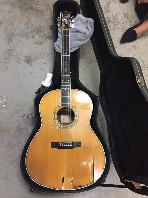 Musician mourns his vintage, handmade guitar stabbed by airport forklift | iNFOnews.ca