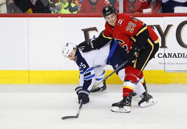 Calgary Flames buy out final year of defenceman Michael Stone's contract | iNFOnews.ca