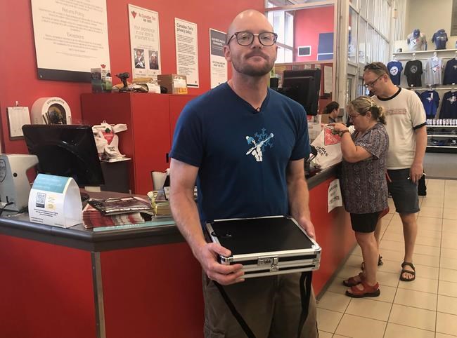 Saskatoon man buys canoe with briefcase full of Canadian Tire cash | iNFOnews.ca Saskatoon man buys canoe with briefcase full of Canadian Tire cash | iNFOnews.ca
