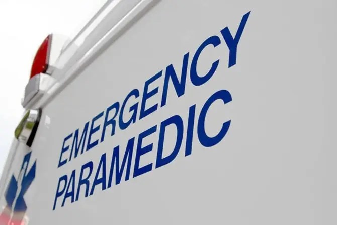 The words Emergency Paramedic on the door of an ambulance.