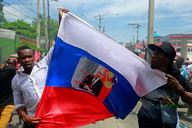 2 deaths as protesters burn tires, block roads in Haiti | iNFOnews.ca CP58199601