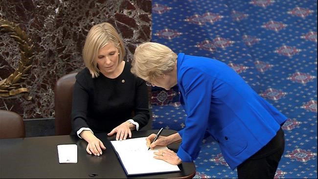 Book it: Senators sign long-used oath book for impeachment | iNFOnews.ca