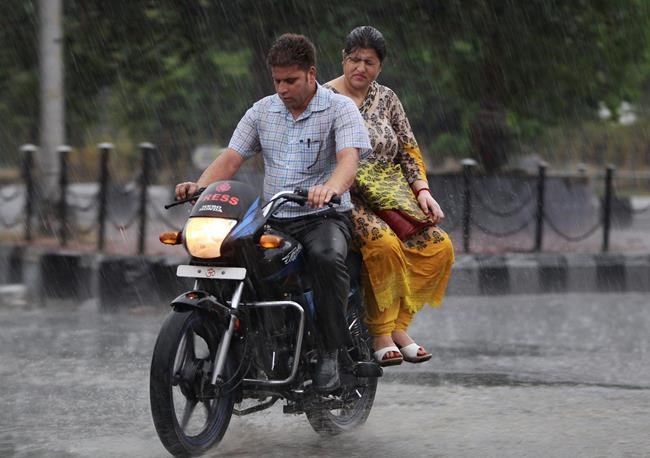 Image of Asia: Driving through the rain in India | iNFOnews.ca