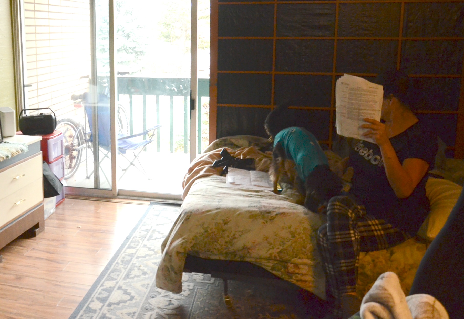 Tiki Village resident Brenda Rutherford sits on her bed in her room at the motel.