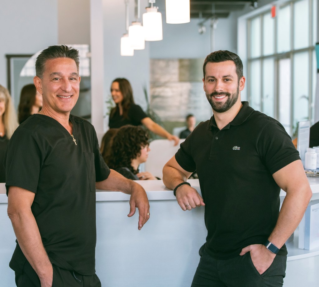 The De Pieri Clinic And The role of Testosterone Therapy in Longevity and Quality of Life | iNFOnews.ca Dr. De Pieri and Dr. Milanovic standing together at the reception desk.