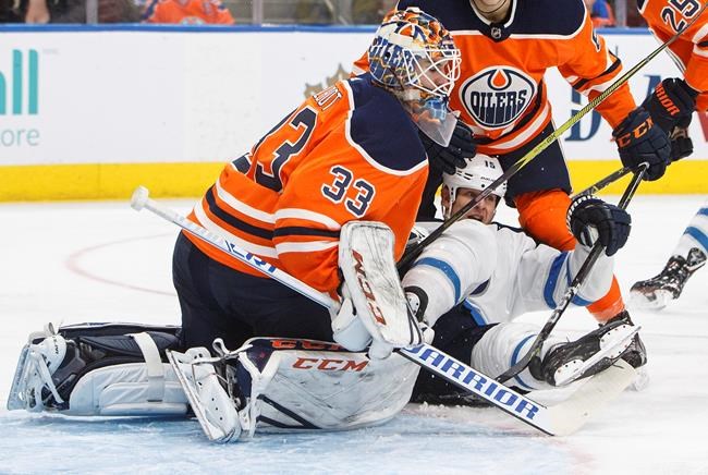 Connor Hellebuyck stops 35 shots to help Jets shut out Oilers 5-0 | iNFOnews.ca CP755530760