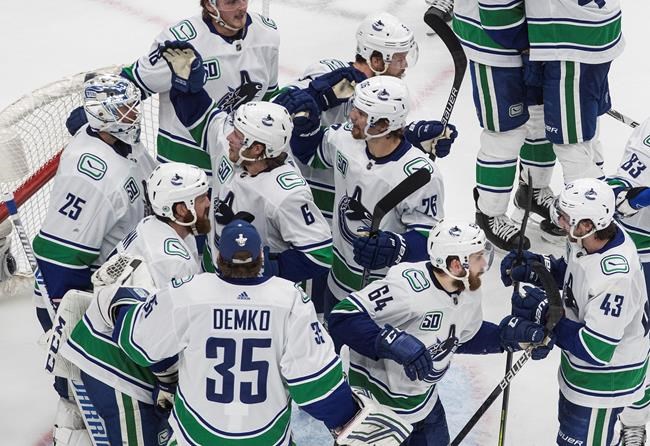 Canucks rally from two-goal deficit, beat Blues 4-3 in NHL playoff action | iNFOnews.ca CP2035208411