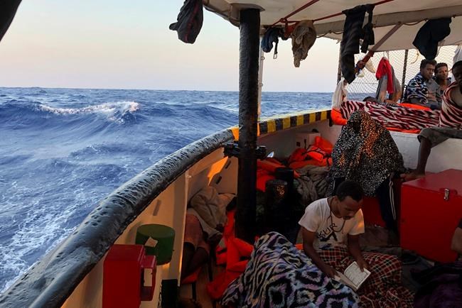 The Latest: 9 migrants let off rescue boat at Italian isle | iNFOnews.ca CP2055492686