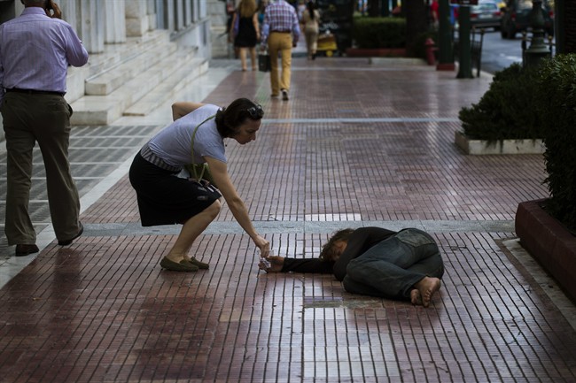 Overspending, austerity, euro flaws have pushed Greece to brink despite bailouts | iNFOnews.ca CP33718443