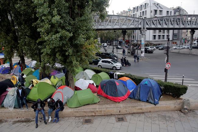 French president vows to clear Paris streets of migrant camp | iNFOnews.ca