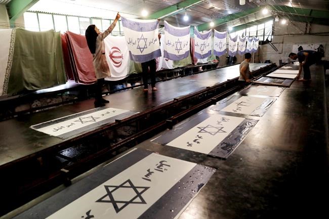 Fire sale: An Iran plant makes the US flags protesters burn | iNFOnews.ca