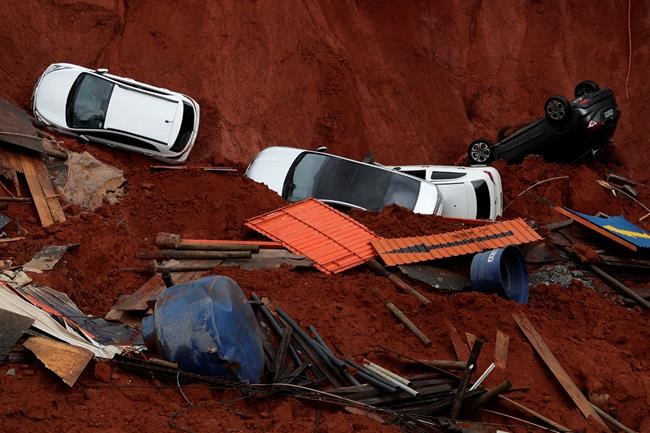 Landslide in Brazil capital spills 4 cars into building site | iNFOnews.ca Landslide in Brazil capital spills 4 cars into building site | iNFOnews.ca