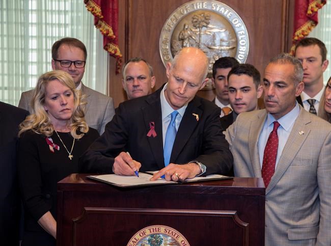 Florida governor signs gun restrictions 3 weeks after attack | iNFOnews.ca CP1137920828