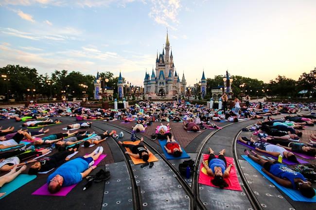 Disney workers find peace with yoga at Cinderella Castle | iNFOnews.ca