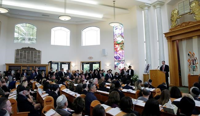 The Latest: Packed synagogue honours woman killed in attack | iNFOnews.ca CP1710937688