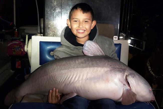 9-year-old boy catches massive blue catfish in New Mexico | iNFOnews.ca