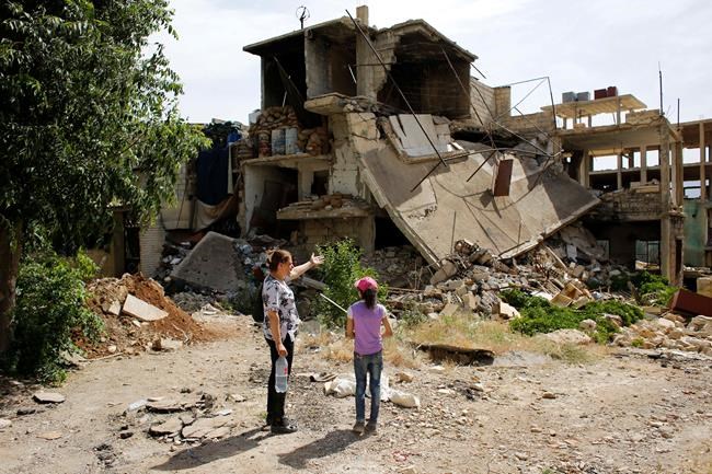 In Syria's devastated twin towns, tears mix with rubble | iNFOnews.ca CP714925684