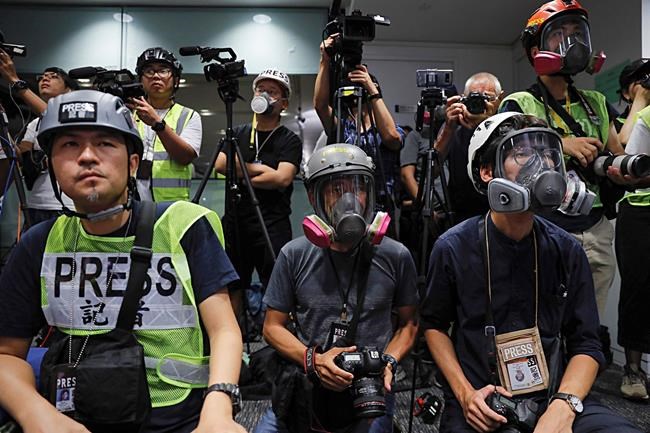 Hong Kong journalists protest new accreditation rules | iNFOnews.ca