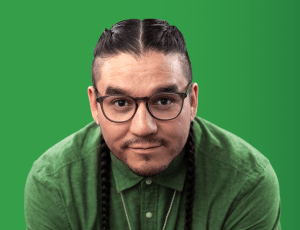 There is a headshot of a man with a green background.