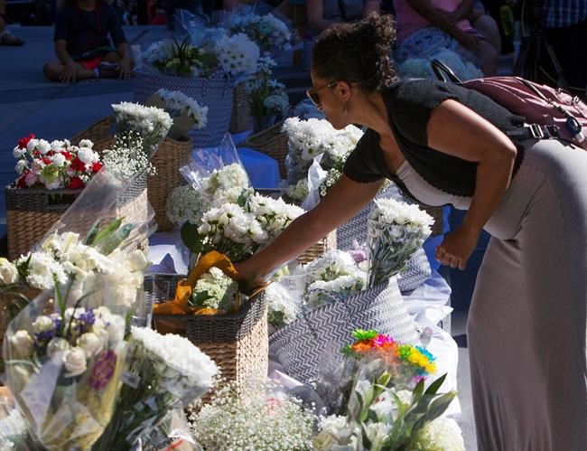 The Latest: Hundreds mourn at vigil for stabbing victims | iNFOnews.ca The Latest: Hundreds mourn at vigil for stabbing victims | iNFOnews.ca