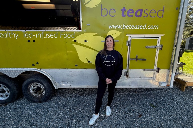 Sharon Toews stands outside her food truck.