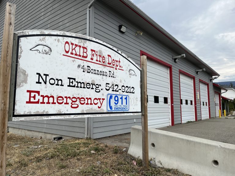 A weathered sign outside the Okanagan Indian Band fire hall.