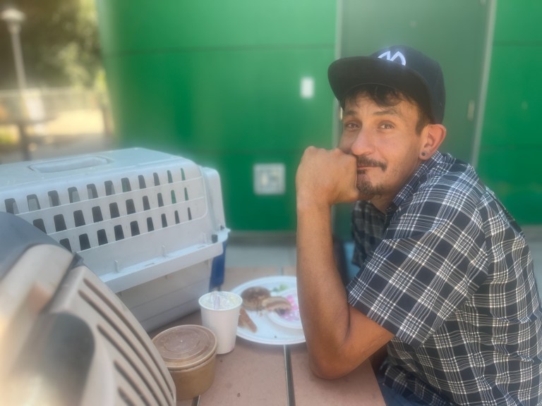 A man sits at a table.