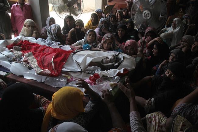 Pakistan holds collective burial for 130 killed in fuel fire | iNFOnews.ca