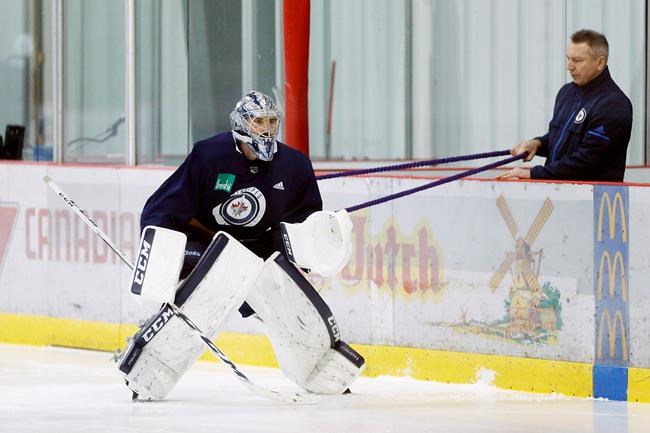 Friends to foes: Jets' Hellebuyck, Wild's Dubnyk ready for playoff goaltending duel | iNFOnews.ca