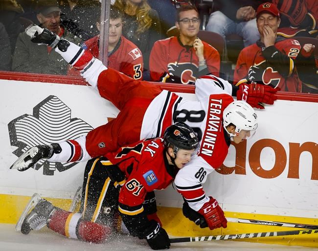 Hurricanes pick up first win of season, downing Flames 4-2 | iNFOnews.ca