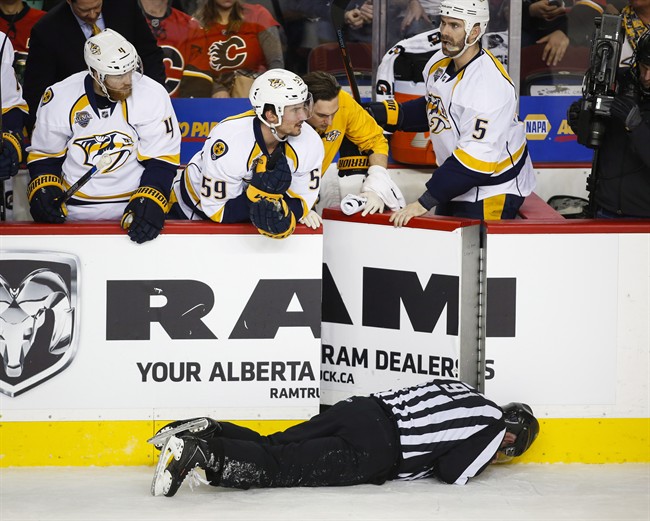 Flames' Wideman sends linesman to ice with check from behind | iNFOnews.ca CP36177397