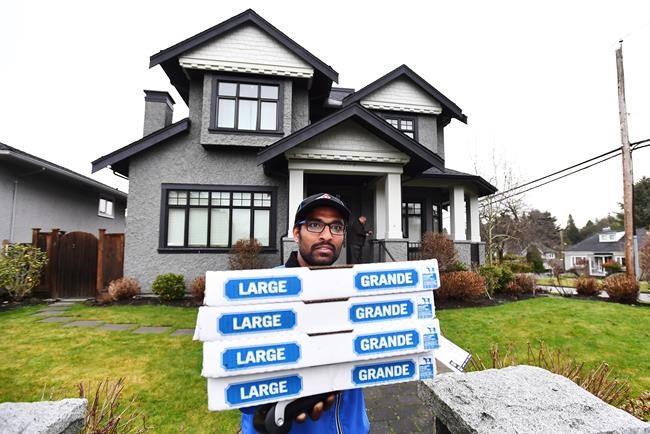 Pizza shared with media camped outside Vancouver home of Huawei CFO | iNFOnews.ca