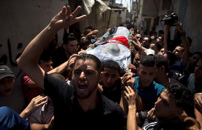 Thousands bury 11-year-old, 2 others killed by Israeli fire | iNFOnews.ca