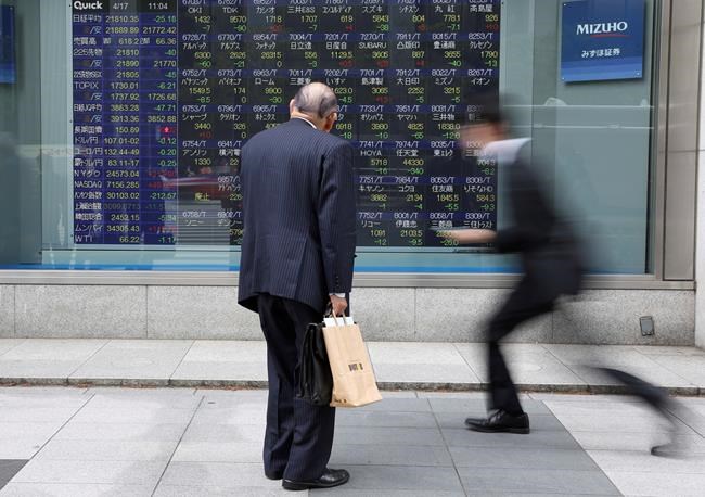 Asian shares mixed, but mostly flat under trade pressures | iNFOnews.ca CP488242481