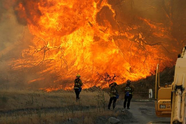 The Latest: Fire crews make gains in massive blaze | iNFOnews.ca The Latest: Fire crews make gains in massive blaze | iNFOnews.ca