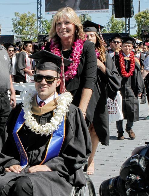 Mom who went to classes with quadriplegic son gets MBA | iNFOnews.ca