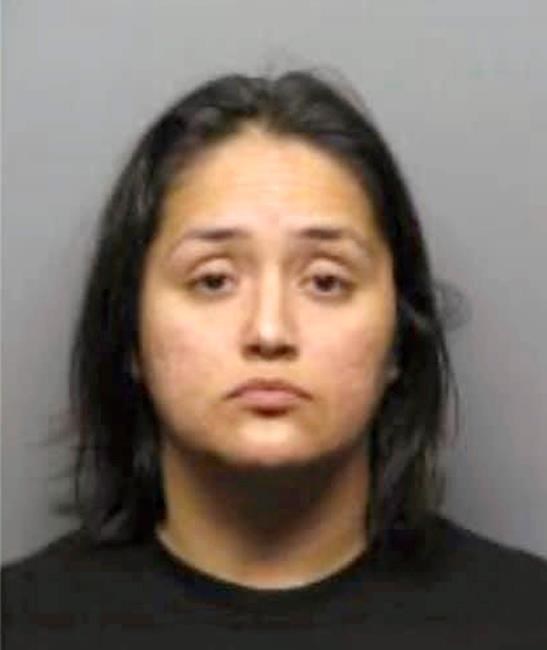 Mom wanted for crashing car into son's barber turns self in | iNFOnews.ca