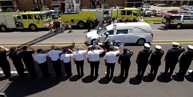 The Latest: Officer's widow calls for unity against violence | iNFOnews.ca