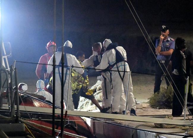 Migrants exit rescue ship in Italy after 19-day standoff | iNFOnews.ca
