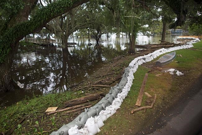 Gov sees flooded subdivision, city saved by sandbag wall | iNFOnews.ca