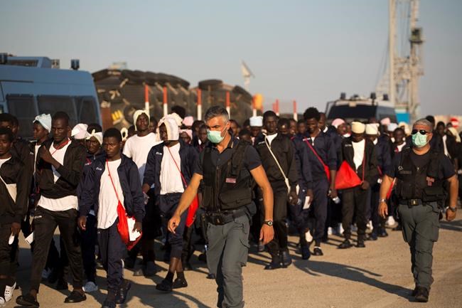 The Latest: Woman gives birth after sea rescue off Libya | iNFOnews.ca