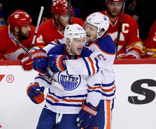 Connor McDavid takes NHL scoring lead with three-point night as Oilers beat Flames | iNFOnews.ca