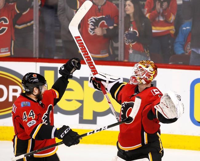 Flames use a three-goal second period to beat Sharks and clinch playoff spot | iNFOnews.ca