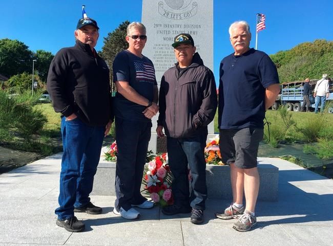 On D-Day beach, 75 years on, awed son follows in dad's steps | iNFOnews.ca CP1983463480