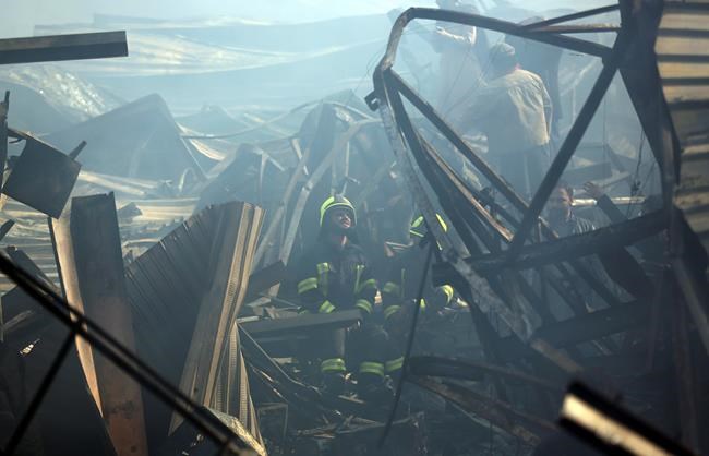 Afghan capital grapples with aftermath of huge market fire | iNFOnews.ca Afghan capital grapples with aftermath of huge market fire | iNFOnews.ca