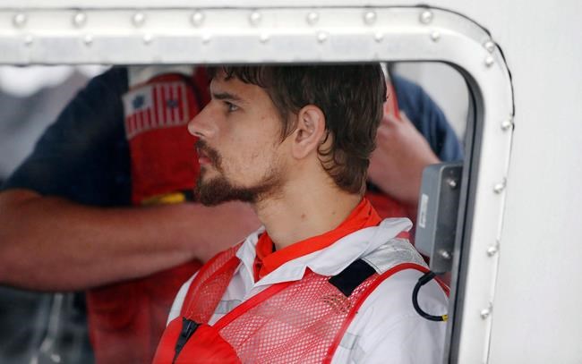 The Latest: Records show man rescued at sea was slay suspect | iNFOnews.ca
