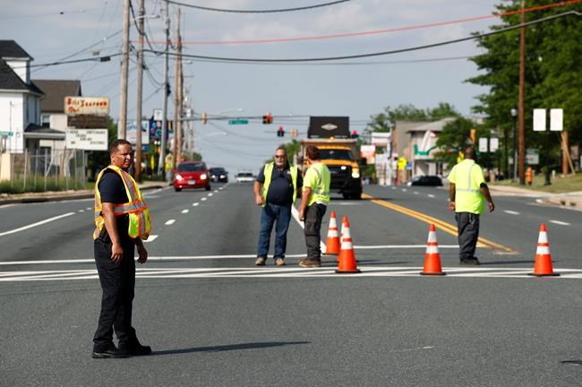 The Latest: Officer's death: Searching at night for suspects | iNFOnews.ca